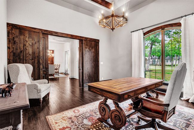 The pocket doors are amazing They slide noiselessly into the wood accent panels framing the doorway to the foyer. | Image 10