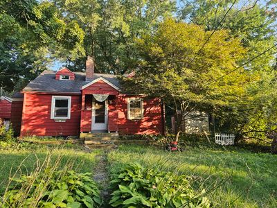 Two floor cape style home located on a small hilltop | Image 1