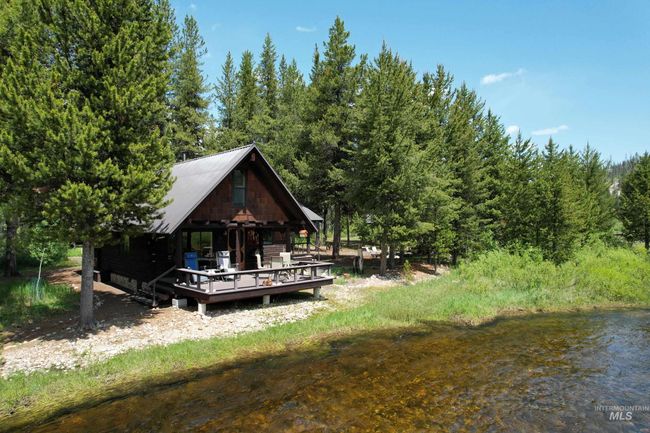 Dock featuring a forest view | Image 19