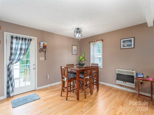 Dining area. Bonus heat source, propane, with above ground leased propane tank | Image 6
