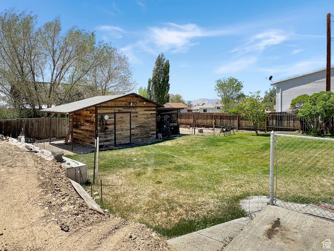 View of yard with an outdoor structure | Image 28