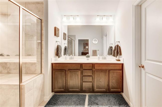 Primary bathroom with two sinks and large walk-in shower | Image 27