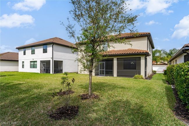 Rear view of property featuring a yard | Image 34