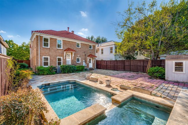 View of swimming pool with an in-ground hot tub, a patio area, and a fenced backyard | Image 33