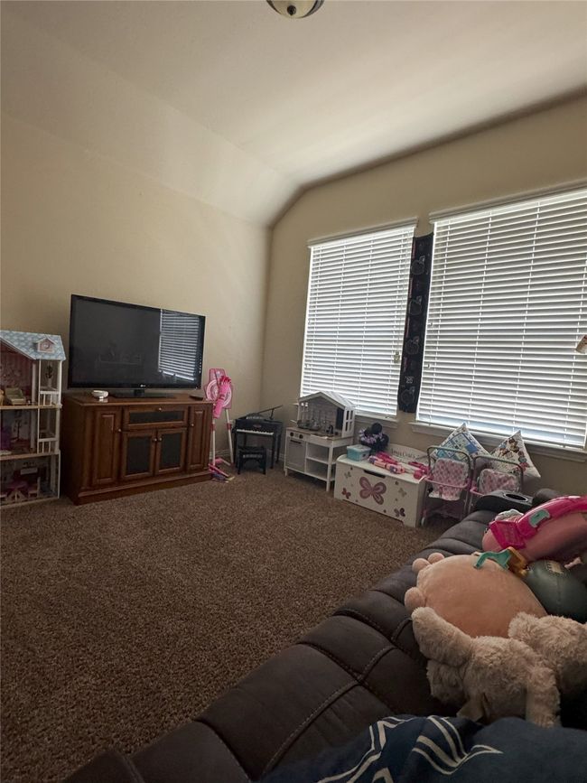 4th bedroom with carpet floors and lofted ceiling | Image 14