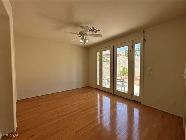 Empty room featuring light wood-style floors and ceiling fan | Image 15