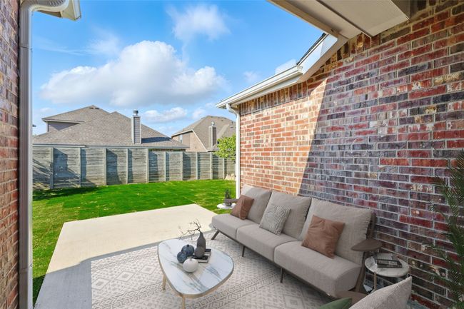 View of patio featuring a fenced backyard and outdoor lounge area | Image 35