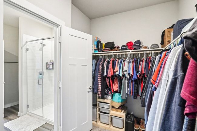 Large walk-in primary closet | Image 23