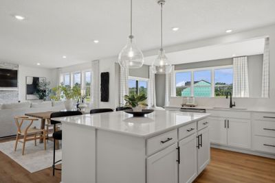 (*Photo of decorated model, actual homes colors and finishes will vary) Enjoy the oversized center island and plenty of cabinet space in this kitchen! | Image 3