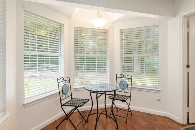 Breakfast Area featuring healthy amount of natural light and wood finished floors. This would also make a great sitting area. | Image 13