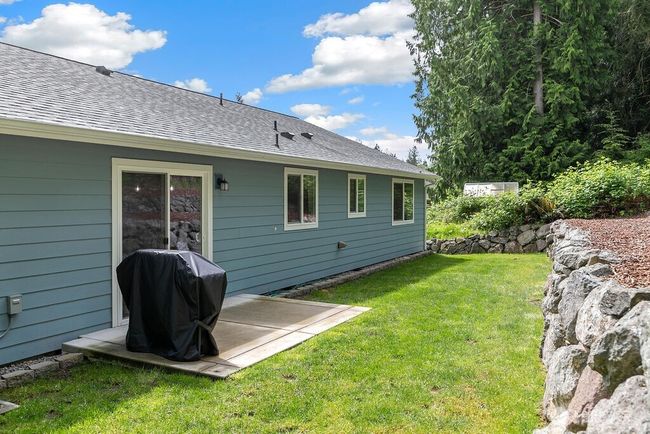 Backyard has poured concrete area, perfect for barbequing. | Image 22