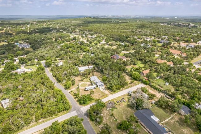 Completely private 1.338 acre lot with no HOA. The sellers own Pitter Pat Ln on the side of the home from the intersection to the fence for added privacy and ability to expand the driveway. | Image 35