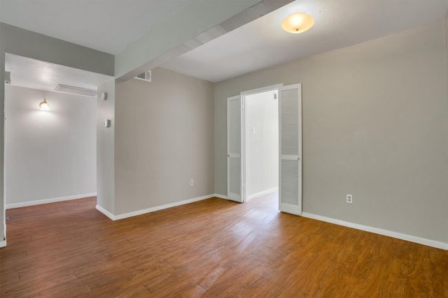 Unfurnished room with finished floors and baseboards | Image 10