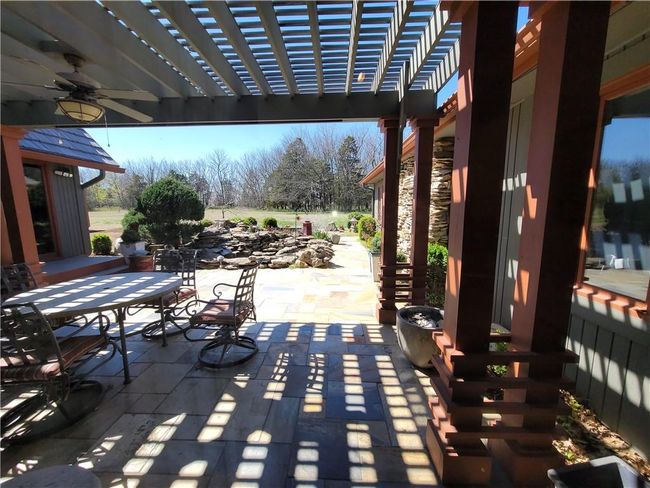 View of patio featuring outdoor dining area and a pergola | Image 57