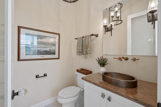 Main level powder room. | Image 13