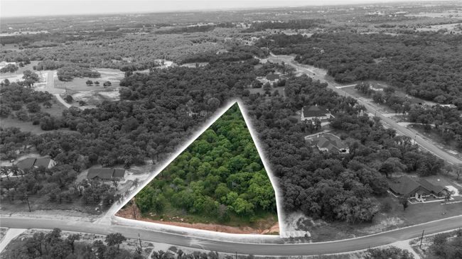 Aerial overview of property's location with property parcel outlined and a forest | Image 6