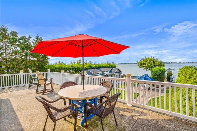 View of patio with a water view and outdoor dining area | Image 33