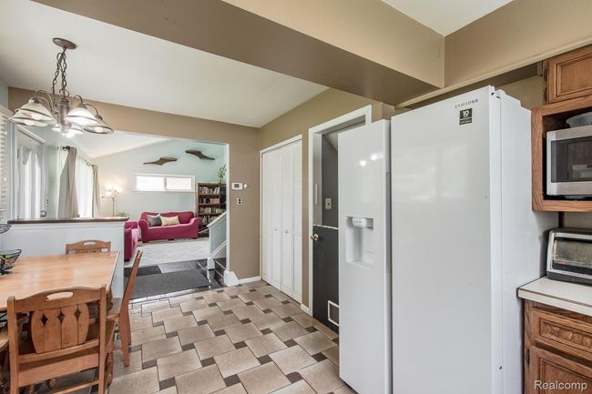 Sizeable fridge and ceramic tile floors | Image 10