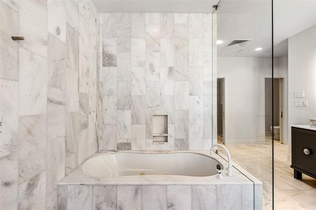 Gorgeous oversized tub with marble surround. | Image 24