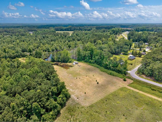 Aerial view of property and surrounding area with a forest and rural landscape | Image 11