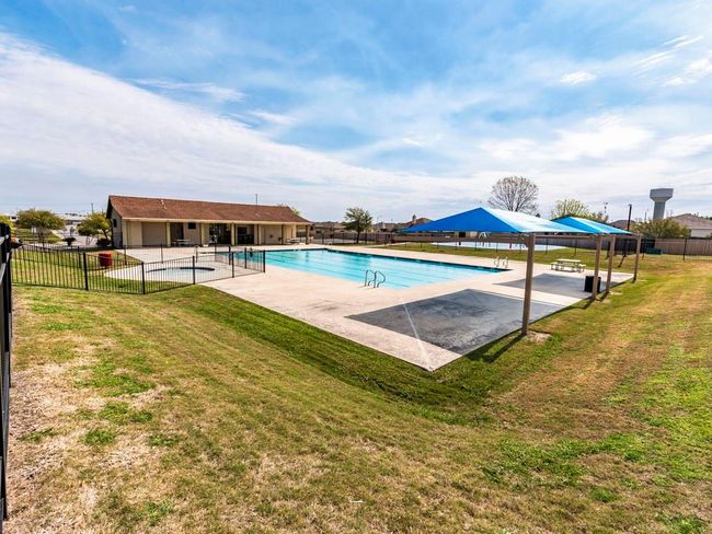 Community pool with a patio area | Image 27