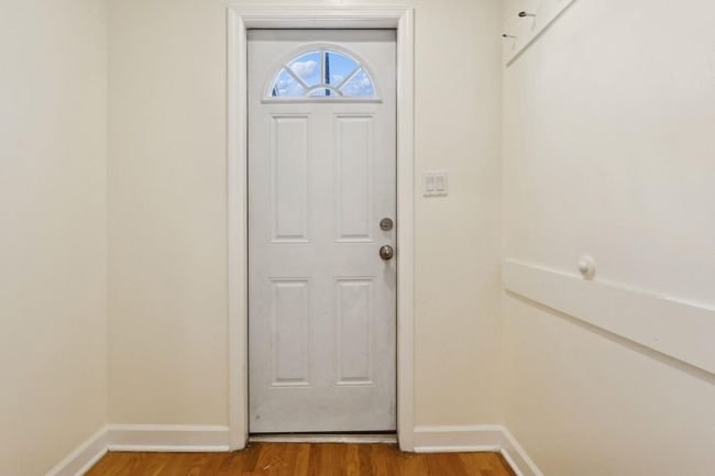 Doorway with baseboards and light wood-style flooring | Image 18