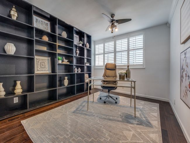 Primary Bedroom #1 with ensuite bath, beautiful floors, decorative light and plantation shutters! | Image 14