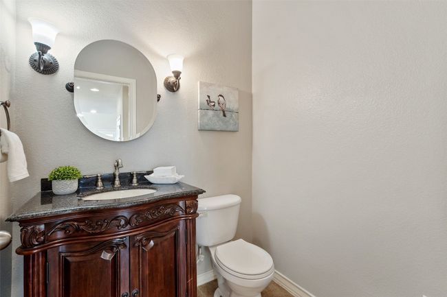 Conveniently located just off the kitchen, this downstairs powder bath is ideal for guests and everyday use. | Image 11