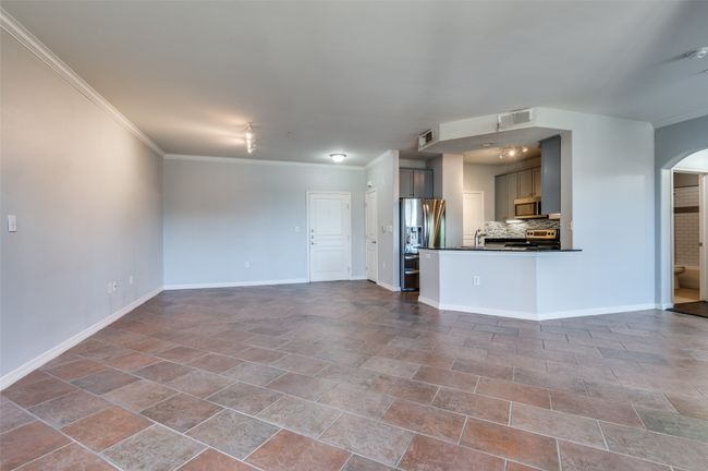 Unfurnished living room with crown molding | Image 22