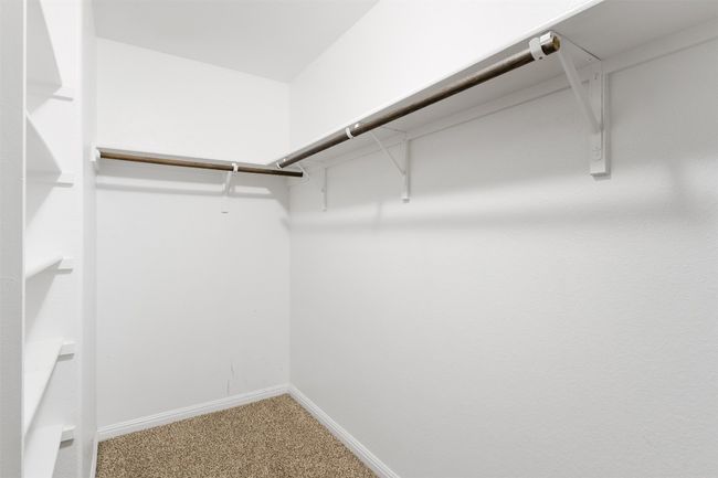Spacious closet featuring carpet | Image 22