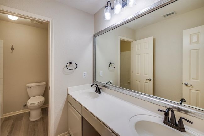 Bathroom featuring wood finished floors and double vanity | Image 29