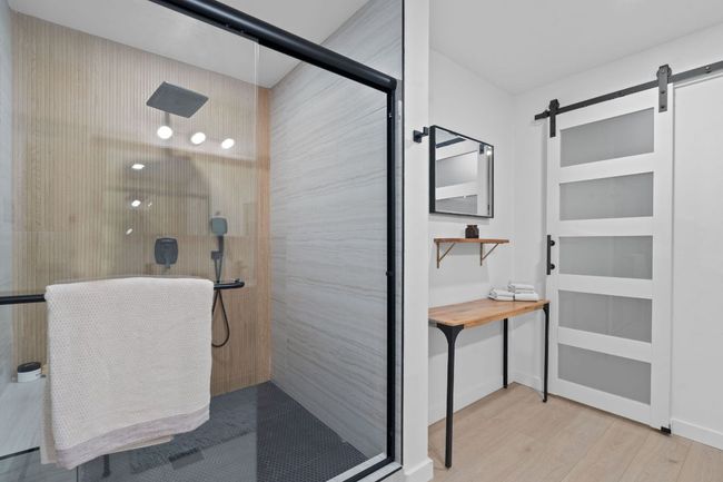 Bathroom with walk in shower and wood finished floors | Image 23