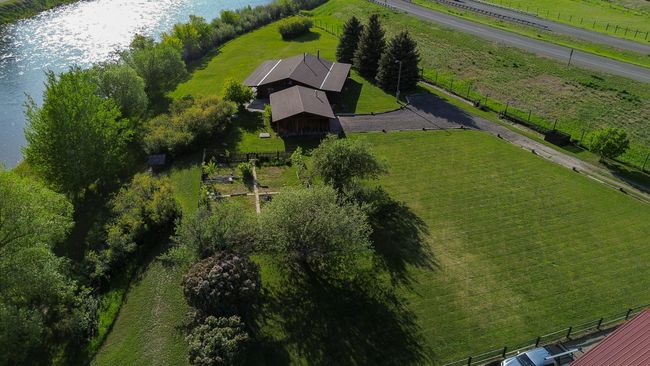 Aerial view of sparsely populated area featuring a nearby body of water | Image 47