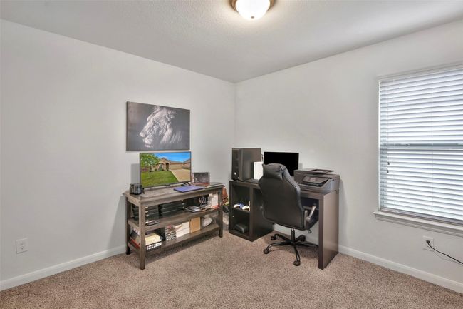Carpeted office space with baseboards | Image 21