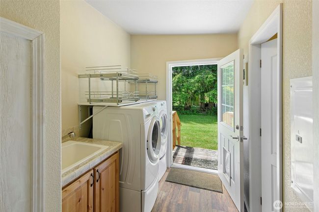 Off the dining area is your laundry. | Image 11
