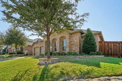 View of front of house with a garage and a front yard | Image 3