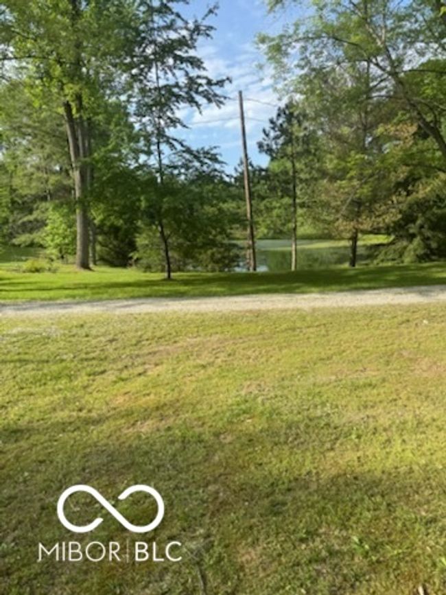 view of community featuring a yard | Image 11