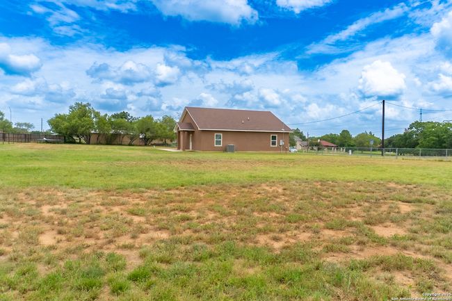 Space for fire pit, BBQ, garden, and storage | Image 31