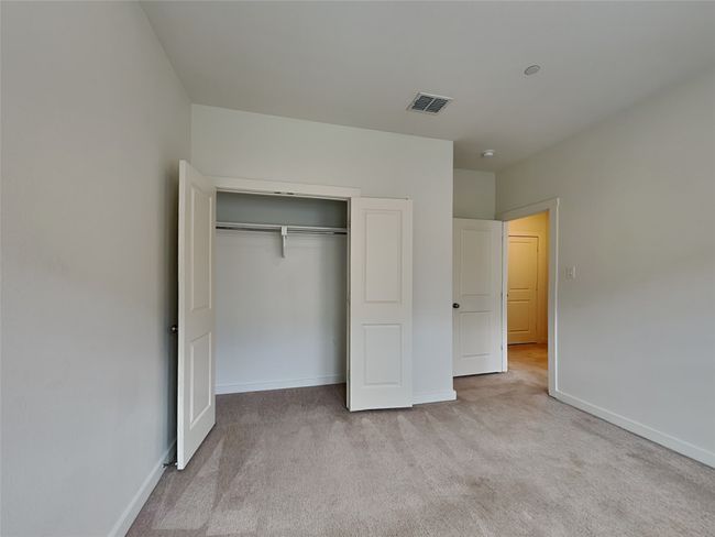 Unfurnished bedroom featuring carpet flooring, baseboards, and a closet | Image 10
