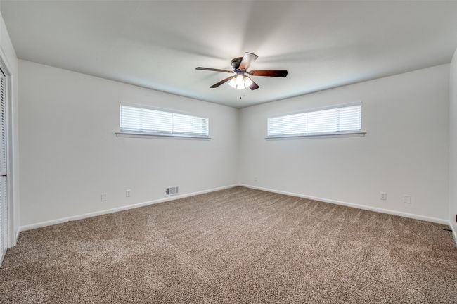 Spacious bedroom with carpet | Image 7
