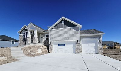 Craftsman-style house featuring a garage | Image 1