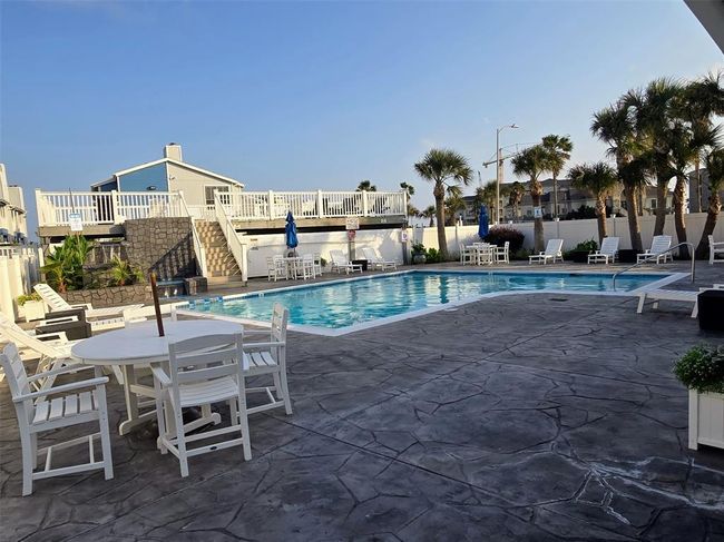 Relax by the pool or unwind on the elevated sundeck as coastal birds glide overhead and palm trees gently sway in the breeze. | Image 12