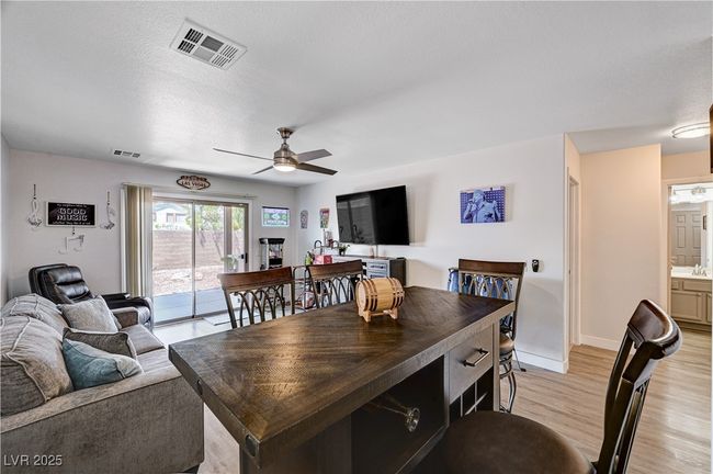 Dining area with a ceiling fan and light wood-type flooring | Image 20