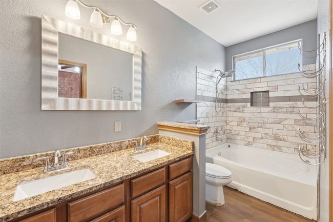 Full bath with visible vents, a sink, toilet, and wood finished floors | Image 12