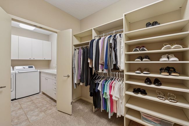 Primary Walk-in Closet that leads to the laundry room | Image 30