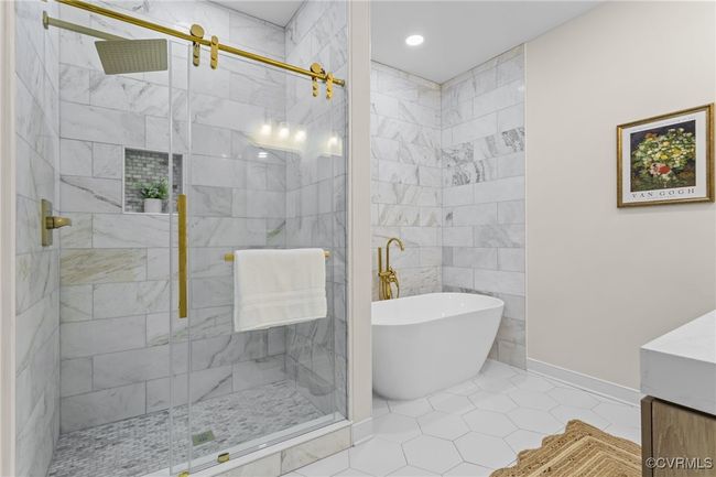Full bathroom with a freestanding bath, a stall shower, vanity, tile patterned floors, and recessed lighting | Image 5