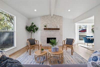 Living room with beautiful fireplace, plenty of natural light, and vaulted ceilings! | Image 2