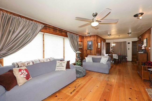The living room looking towards the dining room. | Image 4