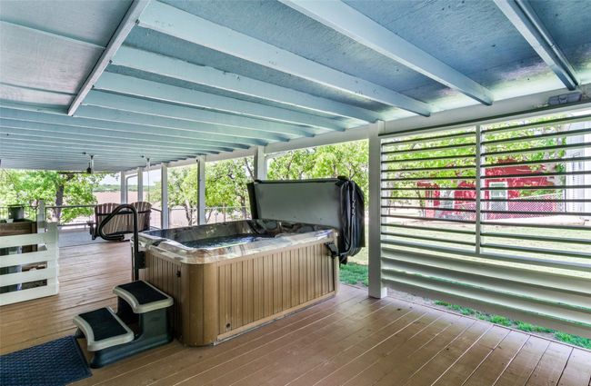 Privacy shutters surround hot tub but don't block those lake views! | Image 23