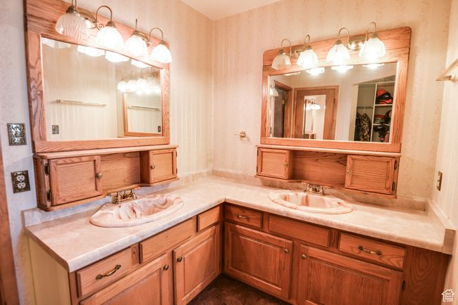 Full bathroom with wallpapered walls and double vanity | Image 20